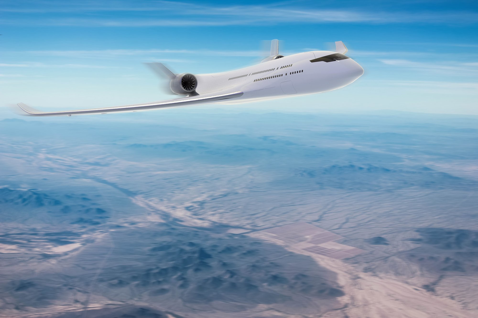 Airliner concept in cruise above desert mountains
