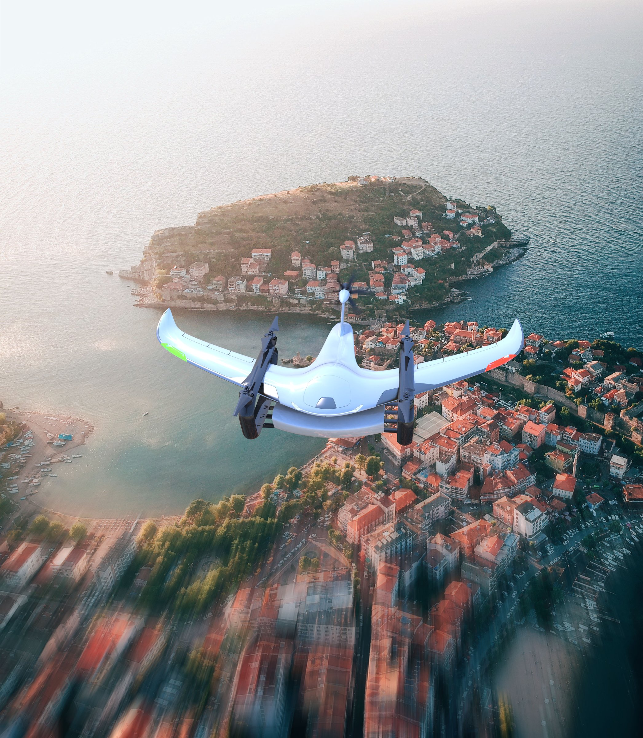 Condor drone approaching a coastal town