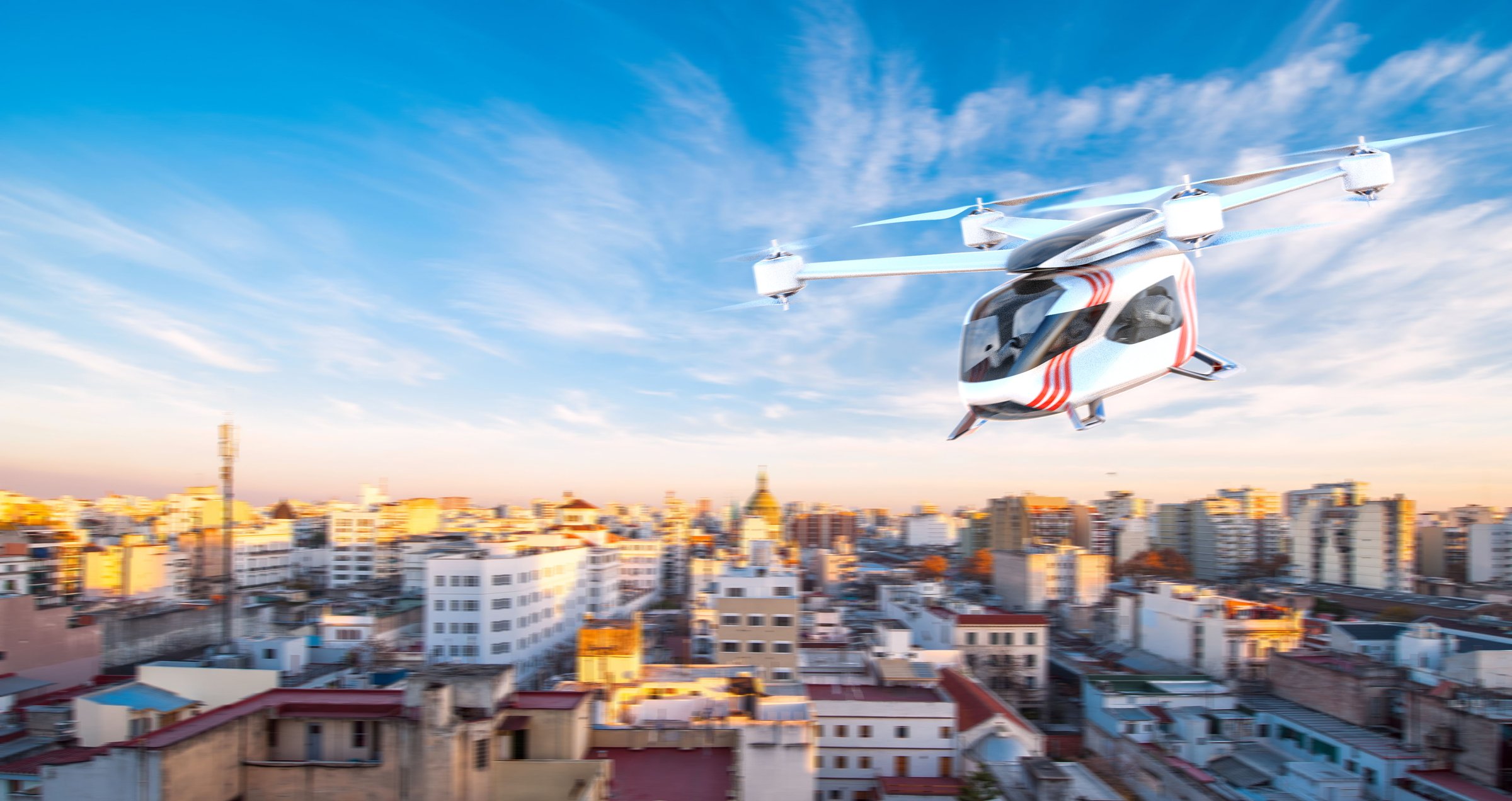 Ambular air-ambulance eVTOL over the city at dusk