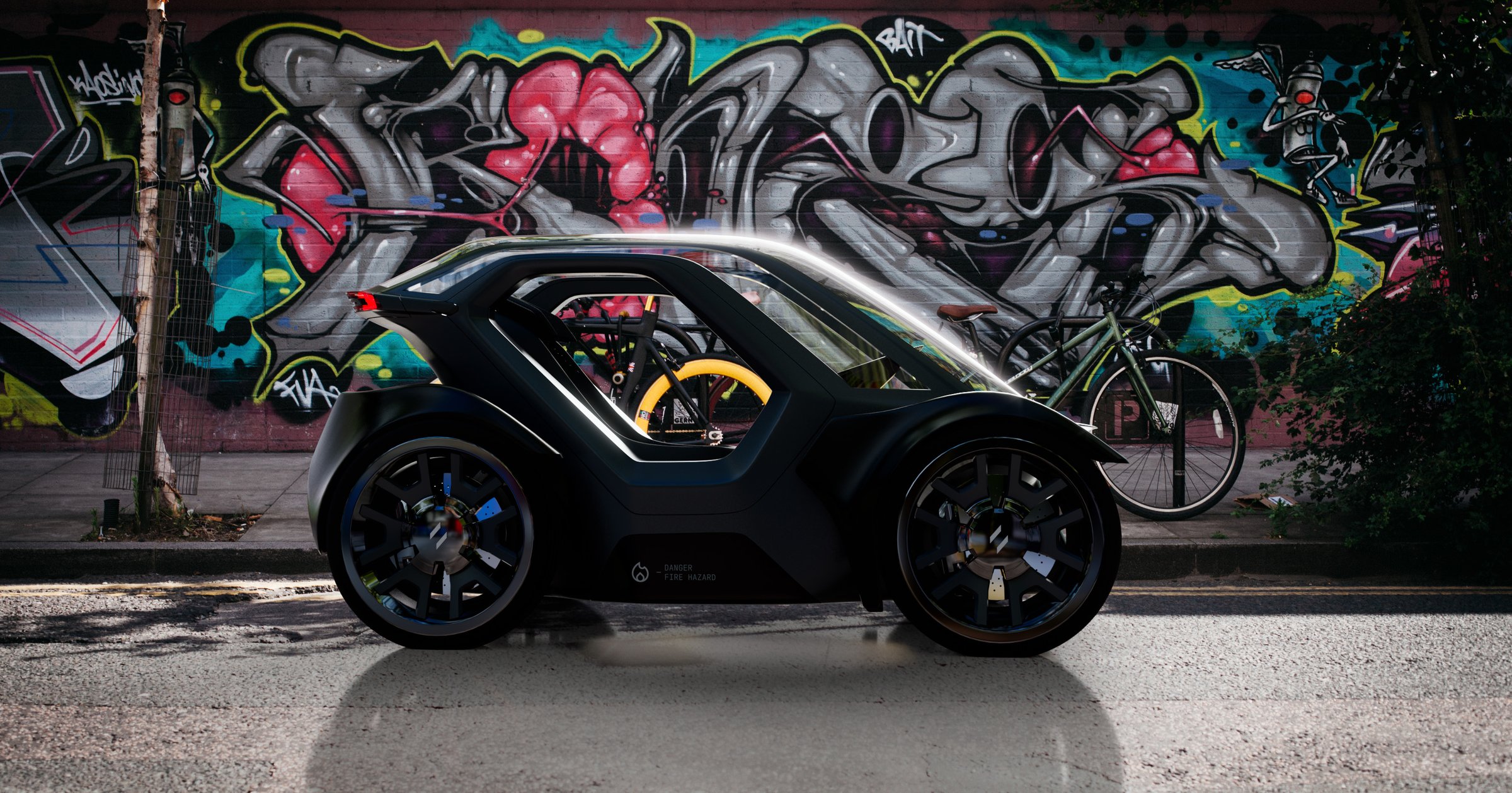 Unicar concept parked beside a graffiti wall