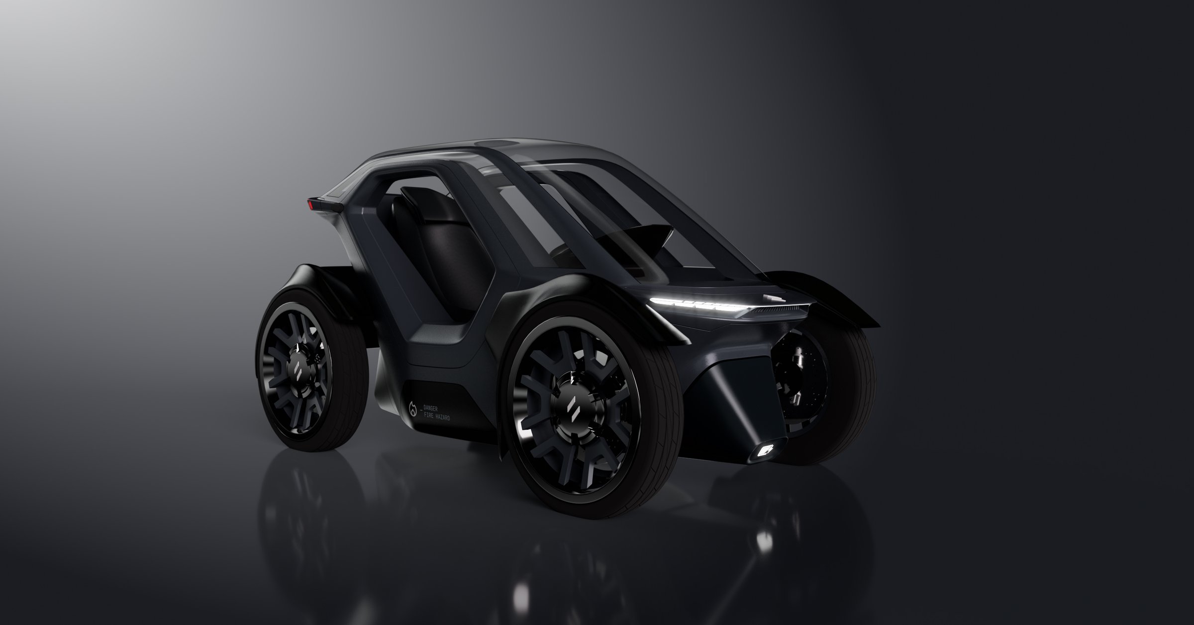Unicar urban EV concept — front three-quarter studio render in black