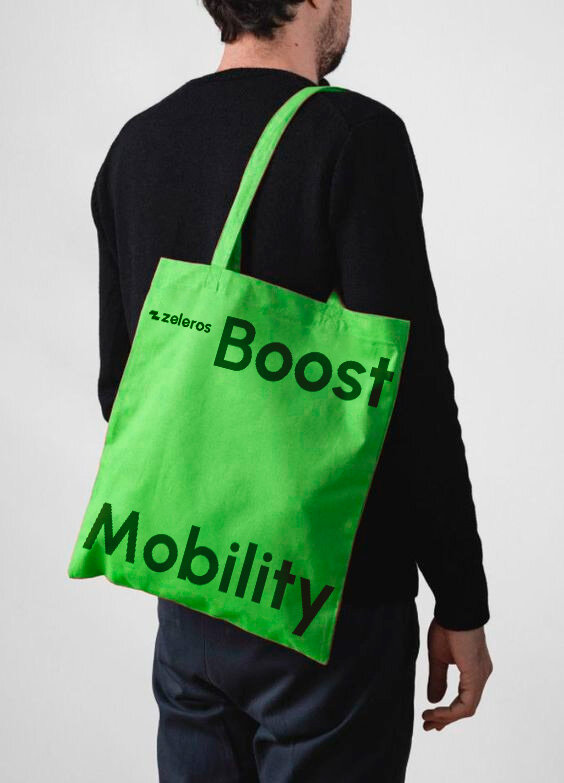 Zeleros green tote bag with Boost Mobility print