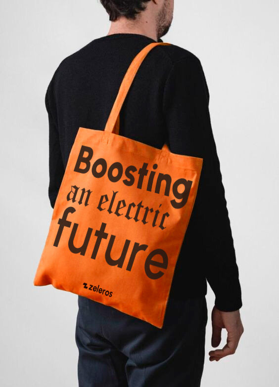 Zeleros orange tote with dark Boosting an electric future print
