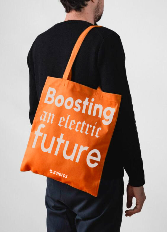 Zeleros orange tote with Boosting an electric future print